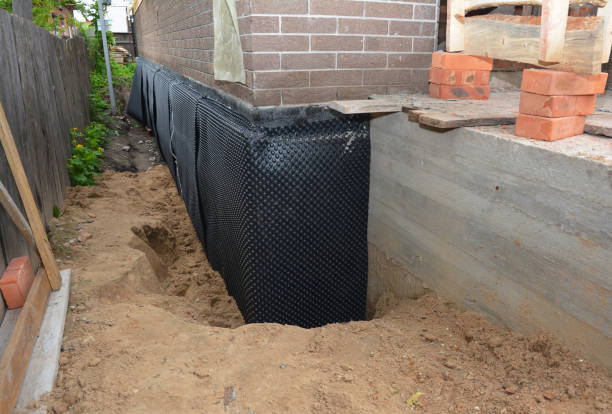 Happy homeowners after waterproofing job in Hymera